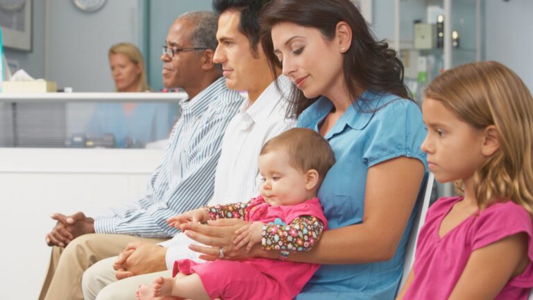 Children waiting in a pediatric clinic during an autism evaluation appointment