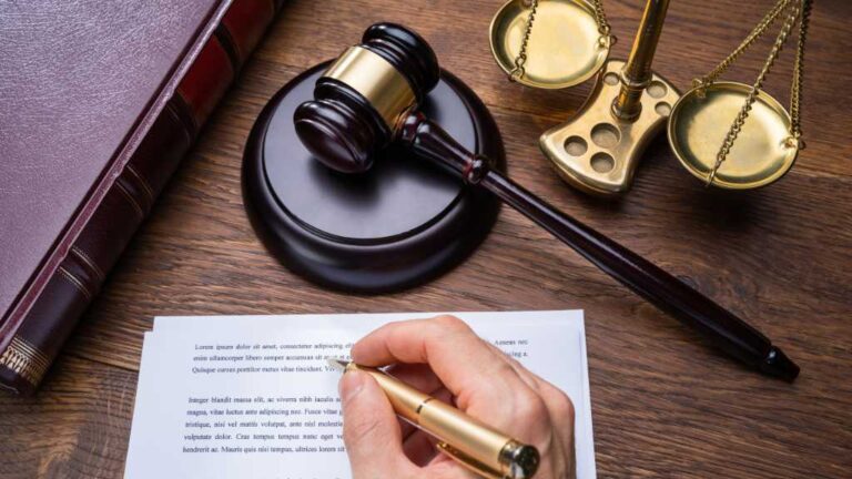 Gavel, scales of justice, and legal documents symbolizing court initiatives like DAAY supporting autistic youth in the criminal justice system.