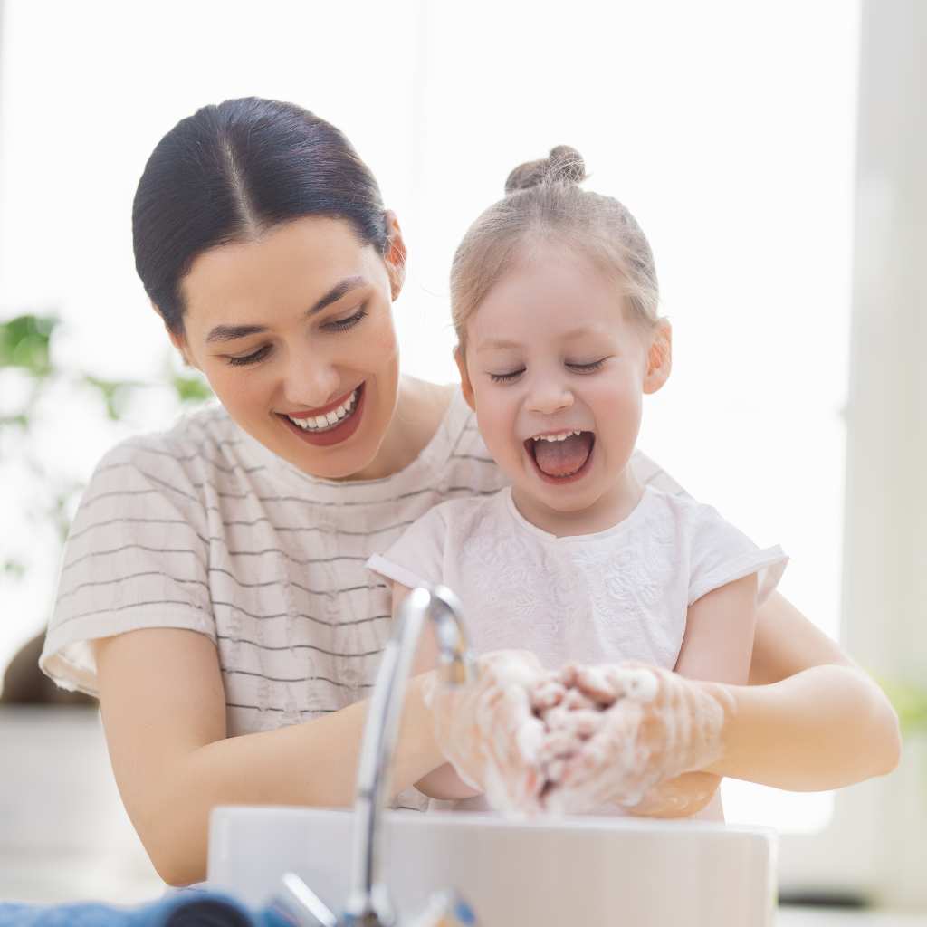 Mom teaching handwashing