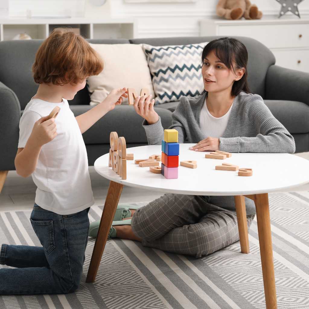 Therapist using educational toys with child during aba therapy session