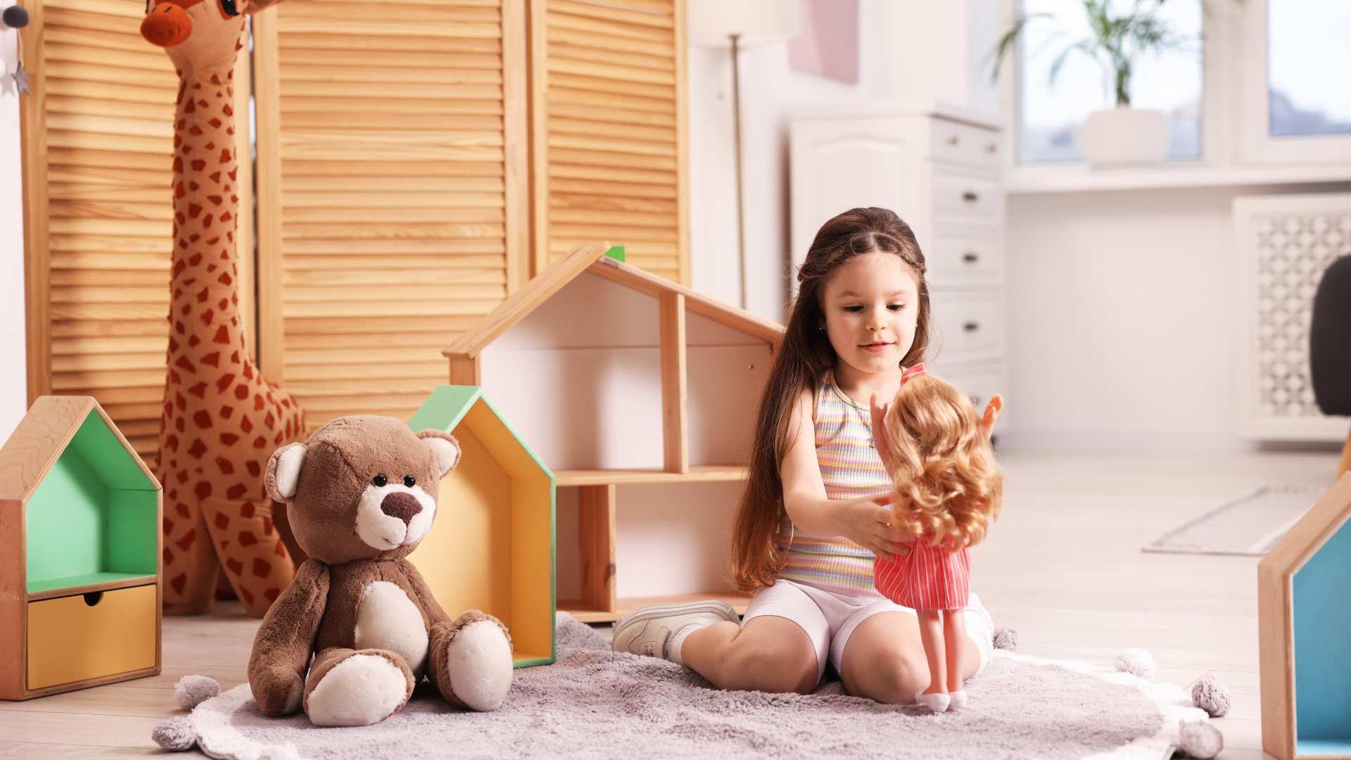 Young girl engaging with an autistic Barbie doll during quiet playtime