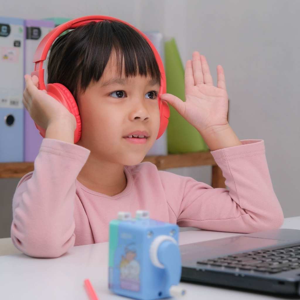 Student using noise-reducing headphones while participating in a classroom activity