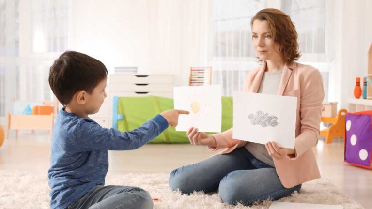 Child participating in autism assessment activity with therapist—illustrating the evaluation process and early signs of autism.