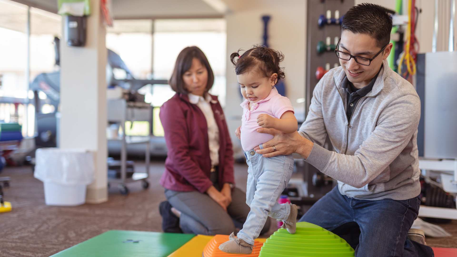 parent and ABA therapist working one-on-one with a child during a structured learning activity
